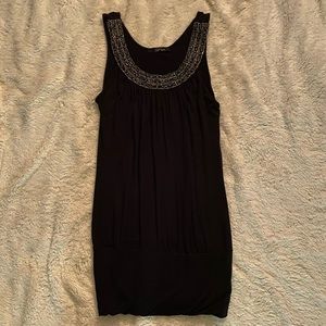 Black top with decorative silver and blue neckline